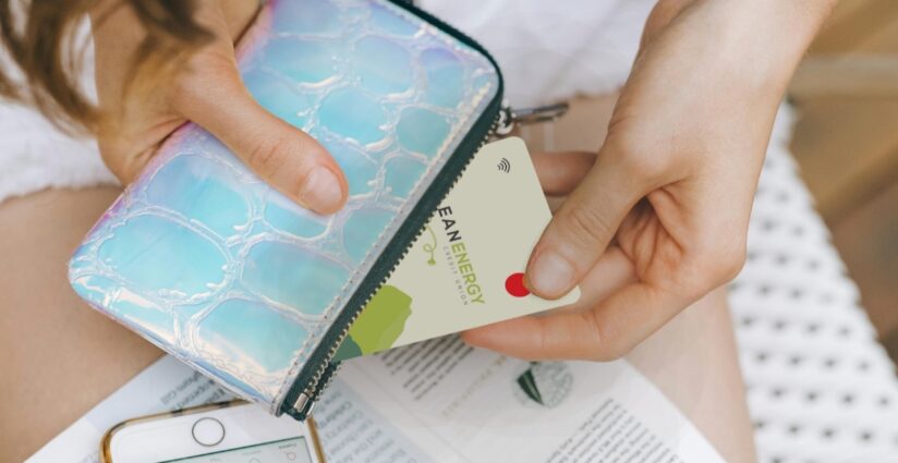 girl holding debit card