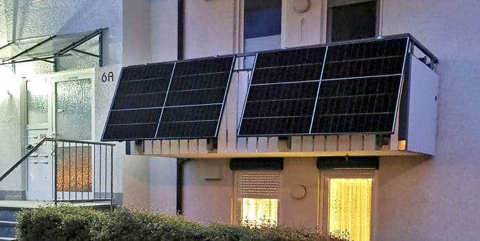 A photo of a balcony with solar panels.