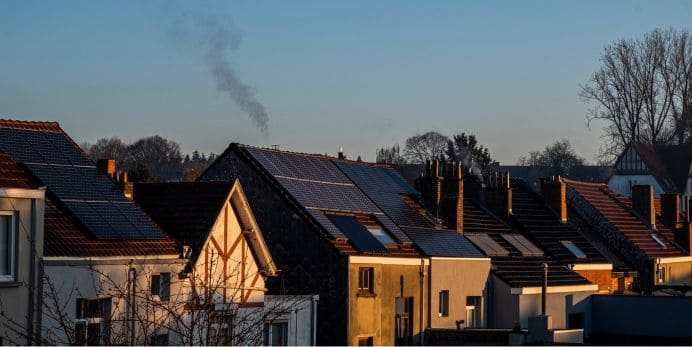 This is an image of several townhomes with solar panels.