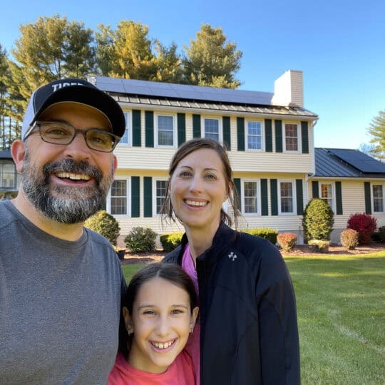 Solar panels on a yellow house, family enjoying renewable energy and sustainable living, clean energy home with solar power, promoting green energy solutions, relevance for Clean Energy CU.