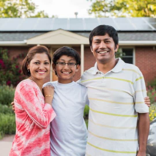 a family in front of their solar system